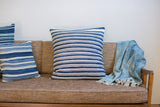 Oversize indigo blue pillow with finely handwoven off-white and dark blue stripes.