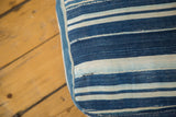 Textured light blue and indigo striped vintage African floor pillow detail.