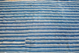 Hand woven indigo blue and cream striped collectible textile with vintage character.