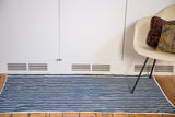 Collectible vintage African indigo hand woven textile runner with blue and white stripes.