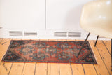 Antique Mehrevan rug fragment: distressed burgundy field with geometric palmette and sky blue pops.