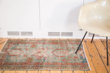 1880s Persian Serapi rug's secured end, featuring short fringe and soft blue, terra cotta.