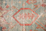 Aged pile texture showing geometric design in powder blue, terra cotta, and ivory tones.