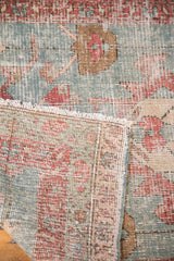 Textured secured edge and fringe of 1880s Serapi fragment, showing brilliant aqua, green, terra cotta.
