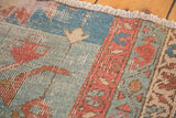 Textured pile of antique Serapi rug, showcasing brilliant powder blue, terra cotta, ivory, and soft green.