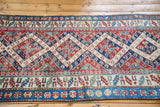Geometric patterns and distressed texture of a late 19th century Kurdish Bijar rug border.