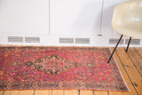 Finely knotted vintage Farahan Sarouk rug in brilliant ruby magenta and complex floral design.