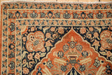 Detailed floral guard bands and spandrel corner of an antique circa 1915 Tabriz rug.