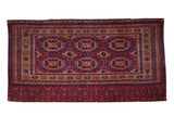 Antique Turkmen Chuval tent cover rug: sextuplet medallions, rich red, navy, beige intricate patterns.