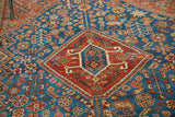 Distressed geometric samovar medallion corner, antique Shiraz rug, vivid sky blue field.