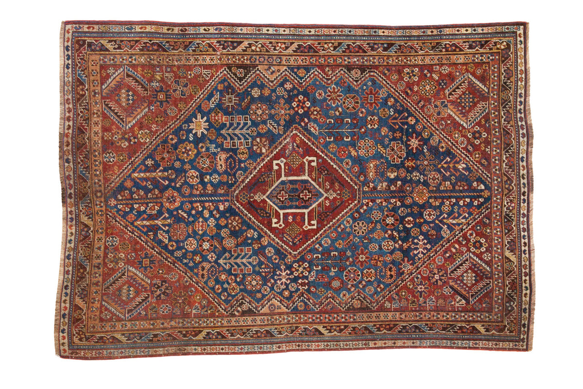 Antique Shiraz rug, vivid sky blue samovar medallion on deep maroon field, 4'8" x 6'7".