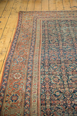 Antique Fereghan carpet showcasing traditional geometric borders and a madder red motif indigo field.