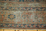 Distressed textural pile and geometric border of an antique Fereghan carpet with fringe.