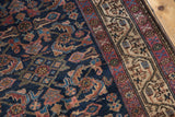 Indigo field of antique Hamadan rug with Herati bird motifs and meandering Serbend border.