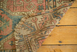 Distressed tattered fringe and faded transitional colors of an antique Avar rug.