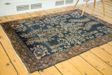Antique Farahan Sarouk rug with navy field, detailed florals, burnt brick borders, soft patina.