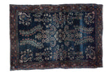 Antique transitional Farahan Sarouk rug, faded navy field with floral designs and burnt brick border.