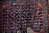 Lustrous wool pile of a vintage Engelas rug featuring a dense Herati design in red and sky blue.