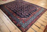 Vintage Engelas rug from an angle, showcasing the high-luster wool and intricate Herati pattern.