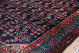 A vintage Engelas rug corner showing the high-luster wool, navy field, and colorful borders.