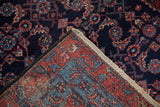 A close-up on the single-wefted construction and rich wool pile of a vintage Engelas rug.