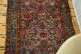 Vintage Lilihan rug with ruby purple field, brilliant blue border, and allover herati design.