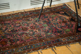 Ruby purple field with brilliant blue allover herati pattern on the vintage Lilihan rug.