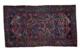 Vintage Lilihan rug with ruby purple Herati field and brilliant blue border.