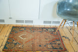 Distressed flat pile and Qashqai-inspired corner motif with visible red wefting.