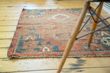 Antique Caucasian rug showing its super worn distressed flat texture and geometric motifs.