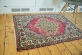 Vintage Meshed rug, raspberry, ornate dark sand medallion, slate blue spandrels, ivory border.