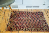 Unusual repeating guls with silk accents on the fine wool pile of this Antique Chuval rug.