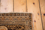 Corner detail of an antique Tabriz rug, showcasing the secured fringe and intricate borders in earthy tones.