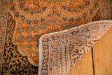 Rich orange pile and hand-knotted foundation with secured fringe on antique Tabriz rug.