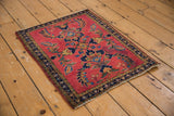 Rich cherry red vintage Mohajeran Sarouk rug featuring a mirrored laurel wreath motif.