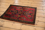 Early 20th century Mohajeran Sarouk rug with saturated cherry red field and detailed floral border.