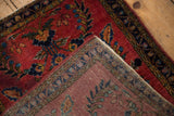Deeply saturated cherry red pile and finely woven foundation of a vintage Sarouk rug.