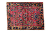 Vintage Mohajeran Sarouk rug mat with deeply saturated maroon red, allover floral bouquets.