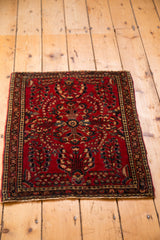 Deeply saturated cherry red vintage German Sarouk rug with elegant floral sprays.