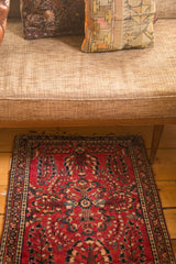 Vintage German Sarouk rug mat, cherry red and deeply saturated, features graceful floral sprays.