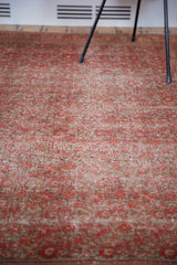 Distressed low pile of an antique Doroksh rug with smokey red and charcoal bronze coloring.