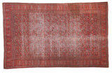 Distressed antique Doroksh rug with an allover vine and leaf pattern in smokey red and charcoal bronze.