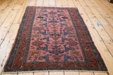 Vintage Lilihan rug: dusty rose field, rare allover Gerrus design, blue, and red borders.