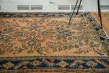 Rosy pink field featuring detailed Herati motif and navy blue turtle samovar border.