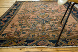 Antique Lilihan rug border with stylized navy blue pattern, rosy pink Herati field, and fringe.