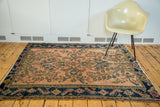 Antique Lilihan rug corner showcasing rosy pink field, stylized Herati and turtle samovar motifs.