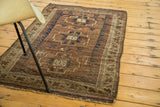 Distressed fringe and intricate geometric borders on an antique Belouch rug, circa 1890.