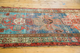 Antique Southern Caucasian rug's central motif with unusual blue abrashes and unique minor border.