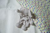 Light gray organic cotton stuffed animal baby elephant with soft texture and ruffled collar.