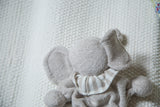 Textured gray organic cotton baby elephant toy's back and striped collar.